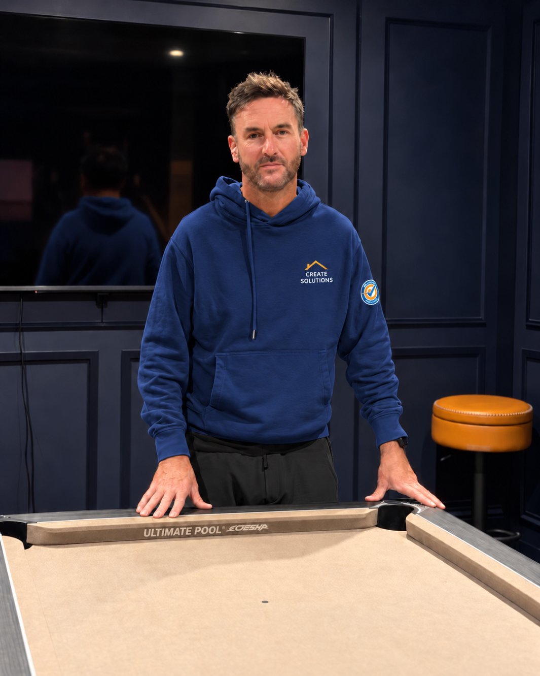 Ross, founder of Create Solutions, in the finished games room at home