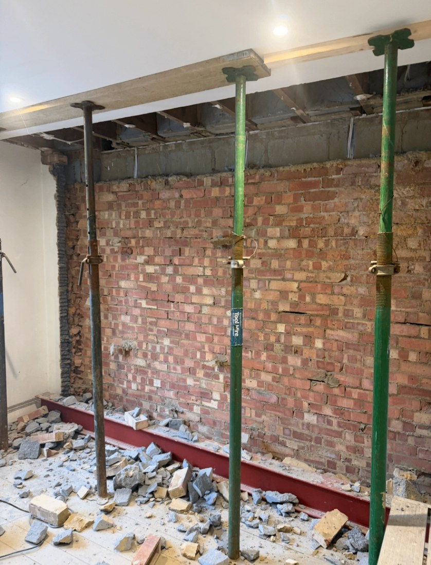 Props holding the opening while the steel is put in place