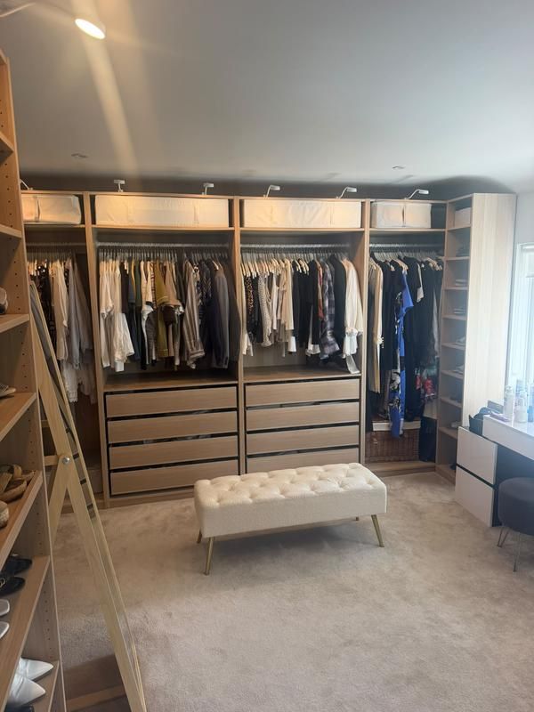Dressing room with open fitted wardrobes