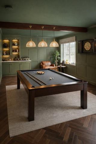 Green-panelled games room with a pool table, herringbone floor and lit shelving