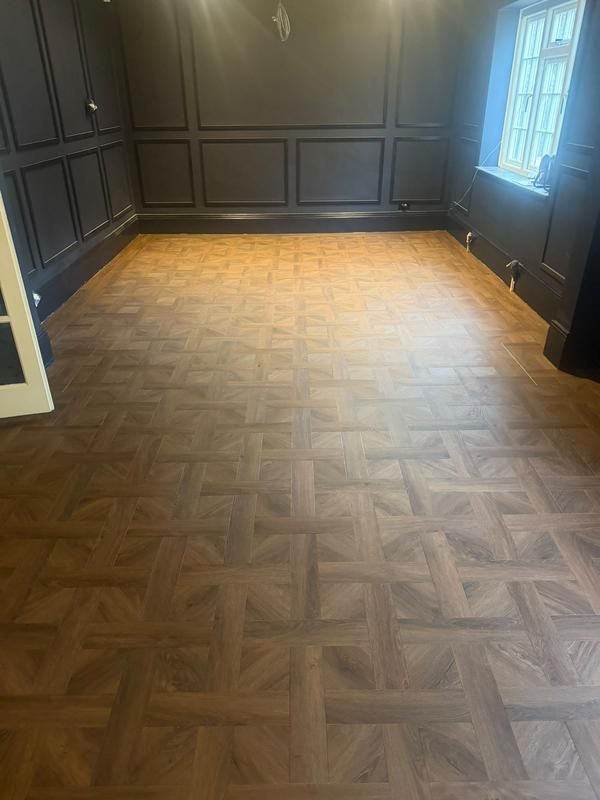 Panelled room with a polished parquet-style floor