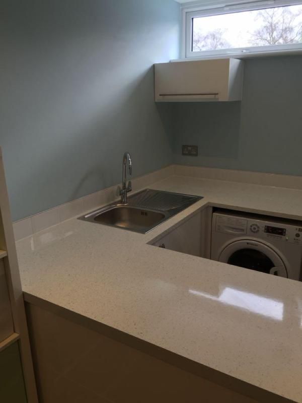 Utility area with worktop and sink in a converted garage