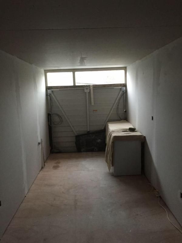 Garage space plastered and prepared during the conversion