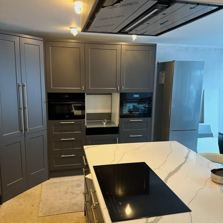Grey shaker kitchen with a marble-effect island