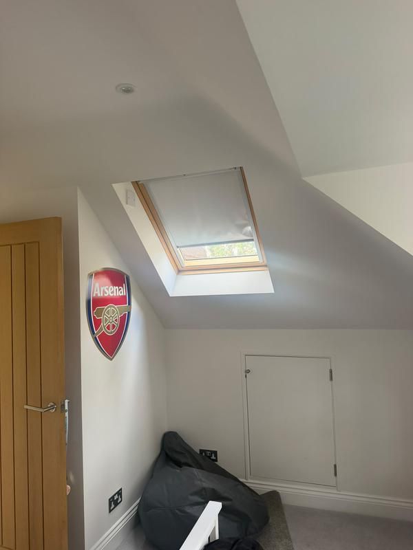 Room with a roof window and sloped ceiling